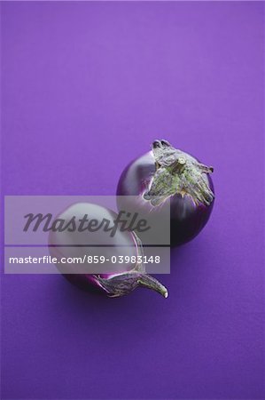 Italian Eggplants On Purple Background