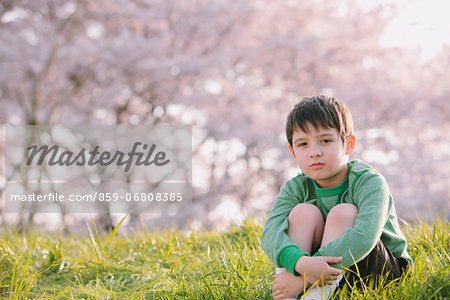 Young boy on grassland looking at camera