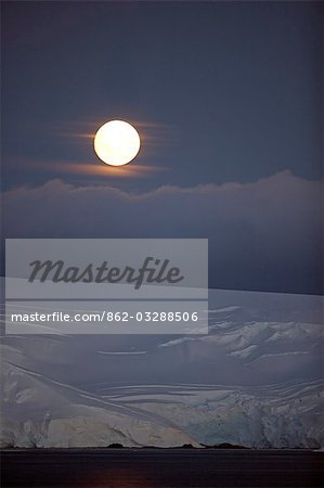 Antarctica,Antarctic Peninsula,Antarctic Sound. Moonrise over Livingstone Island.