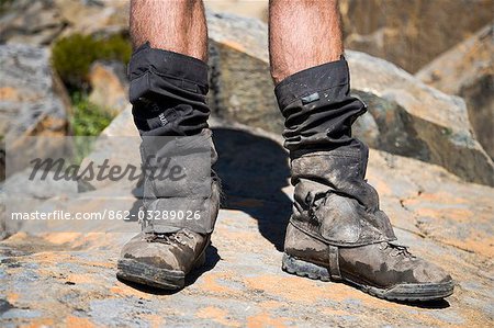 A trekker's muddy boots after hiking the overland Track,Tasmania. .