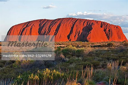 Australia,Northern Territory. Uluru or Ayres Rock,a huge sandstone rock formation,is one of Australia’s most recognized natural icons. The rock appears to change colour in different lights.