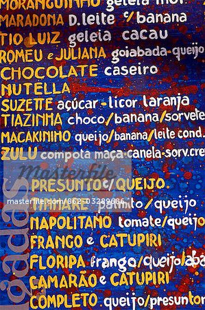 Cafe menu board on the island of Morro de Sao Paulo on the north east Atlantic coastline of the Bahia Region of Brazil