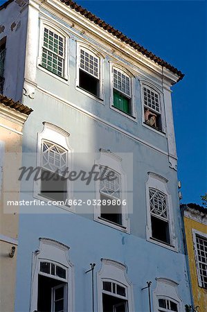 Brazil,Bahia,Salvador. Within the historic Old City,a UNESCO World Heritage site,near the Sao Francisco Church and Convent of Salvador,detail of the renovated classic windows,shutters and facade of colonial style town houses.