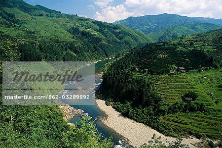 Nr Rongjiang,Guizhou ProvinceIsolated hamlets share limited flat land with terraced rice paddies in a tributary valley of the Duliu River. Guizhou is considered the least developed and remotest of China's southern provinces
