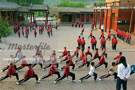Shaolin students exercising and training at Shaolin Monastery,Henan Province,China. Shaolin is the birthplace of Kung Fu martial art.