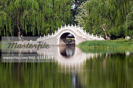 China,Beijing. Old Summer Palace - an arched stone bridge.