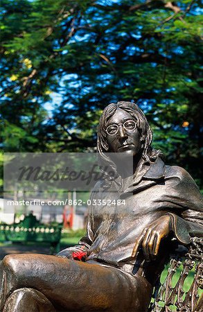 Bronze statue of John Lennon on park bench in Havana city park,Cuba