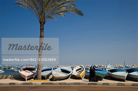 Colourful fishing boats line the corniche along the Eastern Harbour,Alexandria,Egypt