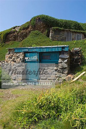 A small fisherman's hut tucked under the lee of the cliff at Cape Cornwall,England