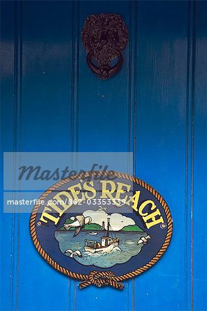 Sign on the front door of a cottage in the Cornish fishing village of Mousehole,Cornwall,England