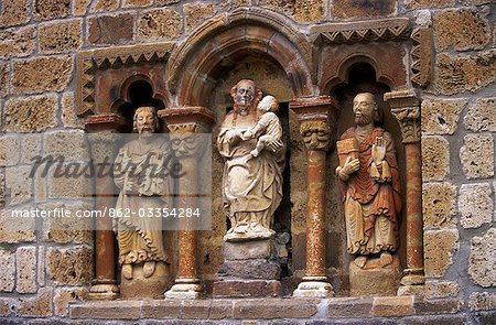 Detail of carved stone figures on the XIIth C Romanesque Church of Santa Maria de Piasca
