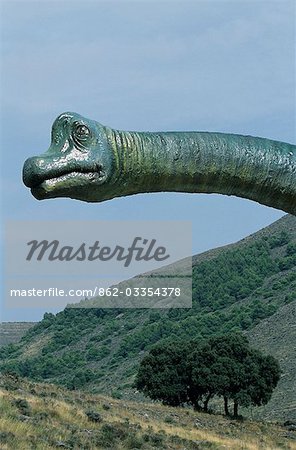 Statue of a dinosaur at the site of dinosaur footprints at La Virgen del Campo. La Rioja Baja conserves some of the most important ichnite remains,fossils and dinosaur footprints in the world.