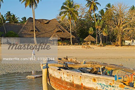 East Africa,Tanzania,Zanzibar. Strolling along the beach at Menai Bay Beach Bungalows,Unguja Ukuu.