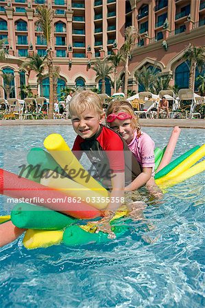 United Arab Emirates,Dubai,The Atlantis Palm Hotel. Children playing in the hotel's Zero Entry Pool enjoying the winter sun and superb facilities.