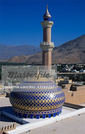 Nizwa mosque,Nizwa,Oman. One of the oldest and most famous forts in Oman is the one at Nizwa. Built in the 17th century at a strategic location,it controlled the routes from the Sunmail Gap to the Interior. It took over 30 years to build this single solid stucture. The mosque is next door to the fort.