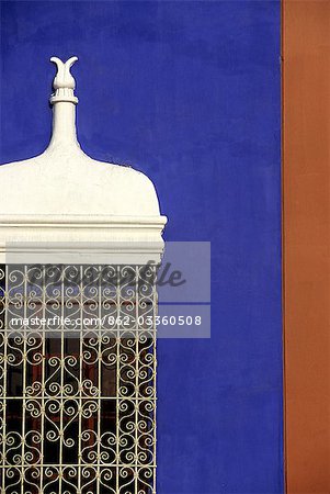 Wrought iron grillwork and pastel shades of a colonial mansion on the Plaza de Armas in Trujillo,Peru. The city in Peru's north,was founded by Francisco Pizarro in 1535.