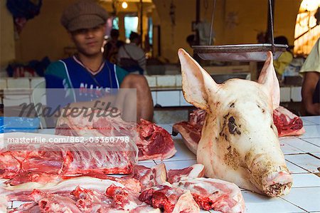 Philippines,Luzon Island,The Cordillera Mountains,Mountain Province. Bontoc food market - pig head on pork stand.