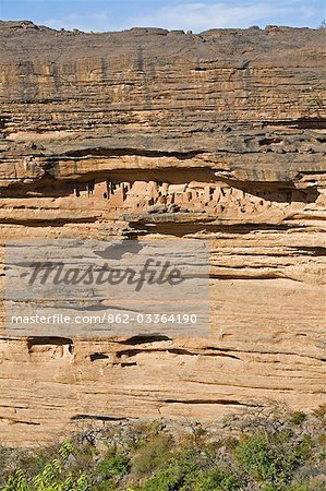 Mali,Dogon Country,Banani. Burial caves of the Dogon near Banani in almost inaccessible sandstone cliffs of the 120-mile-long Bandiagara escarpment. The caves were originally used by the Tellem who were driven out by the Dogon in the fifteenth century.