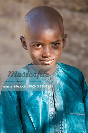 Mali,Mopti. Young Malian boy in colourful Muslim dress.