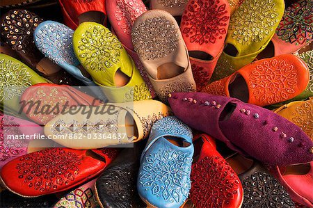 Brightly coloured Moroccan slippers (known as babouche) for sale in the Souq of the Quartier Habous or New Medina in Casablanca.