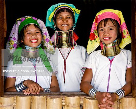 Myanmar,Burma,Lake Inle. Happy Padaung women belonging to the Karen sub-tribe wearing their traditional heavy brass necklaces which elongate their necks.