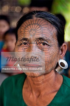 Myanmar,Chin State,Panbaung. A Chin woman with tattooed face. It was customary in the past for girls to be tattooed at 14 or 15 years old,a painful process which took two days.