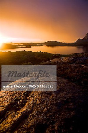 Norway,Nordland,Helgeland. The midnight sun over the islands surrounding the island of Rodoy Island.