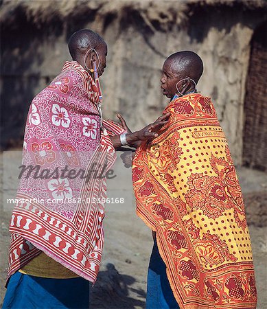 Two Maasai women deep in conversation.