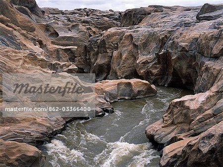 Rock sculpturing at Lugard Falls where the Galana River has carved its course through solid rock. The falls were named after Captain (later Lord) Lugard who played a major part in Britain's colonial history. He crossed Kenya in 1890 on his way to bring peace to troubled Uganda.