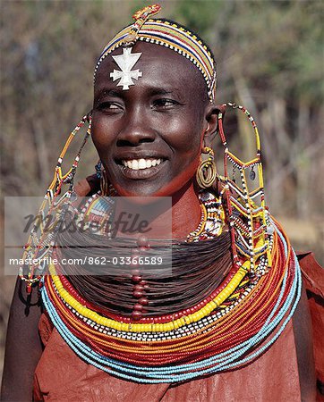 A Samburu woman wearing a mporro necklace,which signifies her married status.These necklaces,once made of hair from giraffe tails,are now made from fibres of doum palm fronds (Hyphaene coriacea). The beads are mid-19th century Venetian glass beads,which were introduced to Samburuland by early hunters and traders.