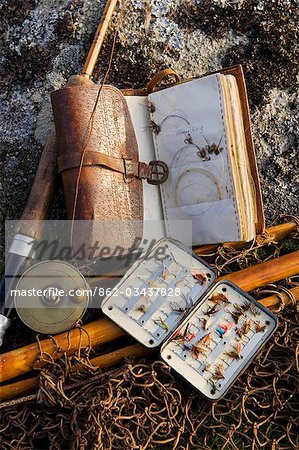 UK,Wales,Conwy. A split-cane fly rod and traditional fly-fishing equipment beside a trout lake in North Wales