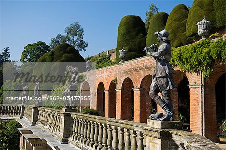 Wales; Powys; Welshpool. View of the Aviary Terrace with its Italianate sculptures of shepherds and shepherdesses and ornate ballustrading at the spectacular garden at Powis Castle