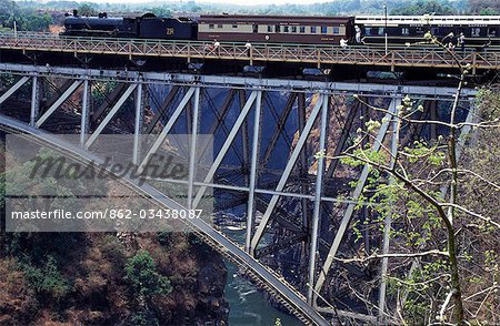 Steam train going over Victoria falls suspension bridge.