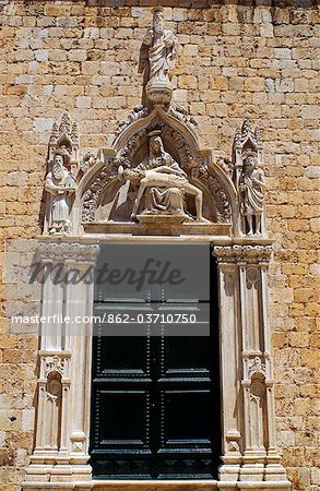Balkans, Croatia, Dubrovnik. South door (1499) of the Franciscan Monastery.