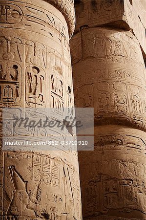 Egypt, Karnak. Hieroglyphics adorn the sides of the massive columns in the Great Hypostyle Hall at Karnak.