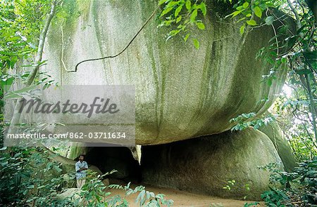 Ghana,Central region,Wassa Domama. The sacred rock shrine at Wassa Domama has several impressive boulders which may be climbed using vines.