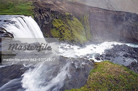 Iceland. The active tectonic nature of the interior of Iceland has resulted in a landscape dotted with spectacular waterfalls,such as this one viewed from the top near Laugavegur.