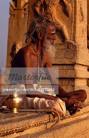 A wandering ascetic or sadhu,rests in the porch of a shrine on Hemakuta Hill