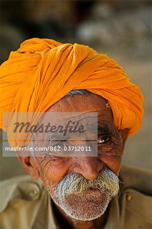 India,Rajasthan,Jaisalmer. Inside of Jaisalmer Fort,a stall holder in the market has a face that reflects his life struggle.