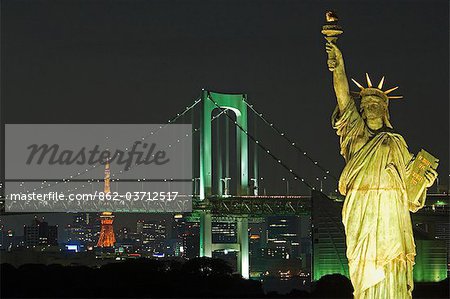 Tokyo skyline at night including the Tokyo Tower,the Rainbow Bridge and the Statue of Liberty.