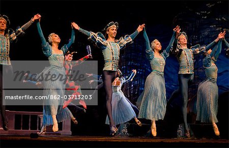 Russia, St.Petersburg; Ballet dancers doing a collective jump during a performance of Tchaikovsky's 'Swan Lake'