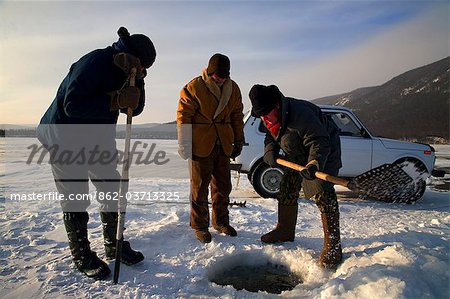 Russia, Siberia, Severo-Baikalsk. Undergoing preparations to fish on frozen Lake Baikal, in Winter the Lake can hold a car