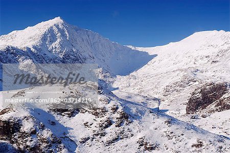 Wales, Gwynedd, Snowdonia. Mount Snowdon frozen and covered in snow in winter from the east.