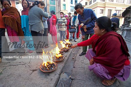 Nepal, Kathmandu, Pilgrims at the Swayambunath Temple (Monkey Temple) which sits a on a hill with superb views over the Kathmandu Valley