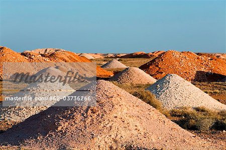 Australia, South Australia, Coober Pedy.  Piles of earth dug from the many mines shafts in the Coober Pedy opal fields.