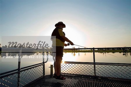 Australia, Northern Territory, Kakadu National Park, Cooinda. Fly fishing for Barramundi at the Yellow Water Wetlands. (PR)