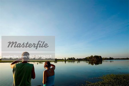 Australia, Northern Territory, Kakadu National Park, Cooinda.  Tourists look out over the Yellow Water Wetlands.(PR)