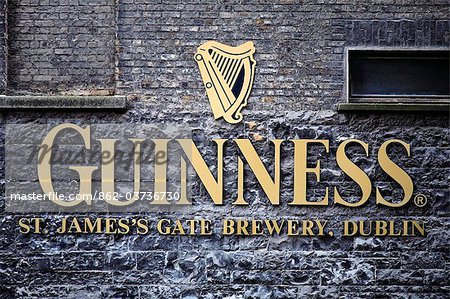 Ireland, Dublin, St James Gate, The Guinness logo and trademark on the wall of the St. James' Gate Brewery.