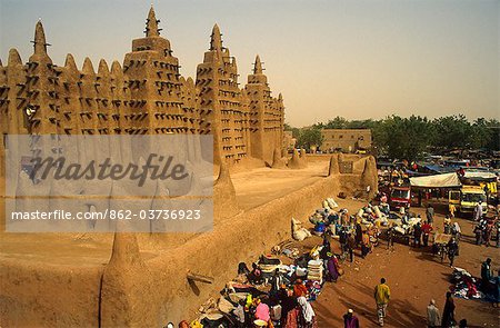 Mali, Djenne. Market stalls beside the Mosque of Djenne, or Grande Mosquee, one of Africa's most striking mud brick buildings.