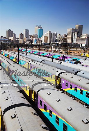 Train carriages at Park Station with city skyline in background, Johannesburg, Gauteng, South Africa Train carriages at Park Station with city skyline in background, Johannesburg, Gauteng, South Africa